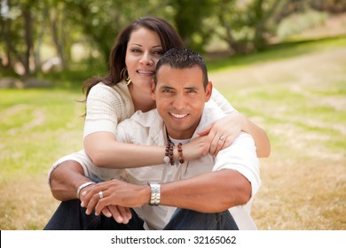 Affectionate Happy Hispanic Couple in the Park. - Powered by Shutterstock