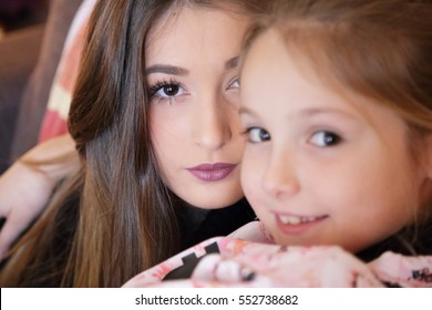 Affectionate hug between sisters