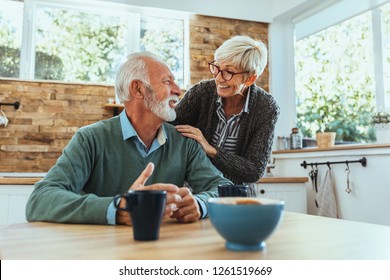 Affectionate Mature Couple Enjoying A Cup Of Coffee