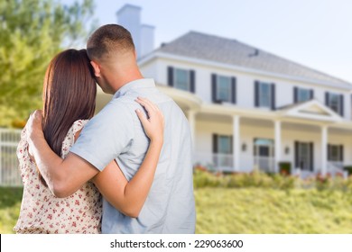 Affectionate Military Couple Looking at Nice New House.