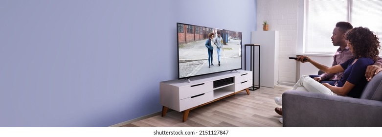Affectionate Young Family Watching TV At Home - Shutterstock ID 2151127847