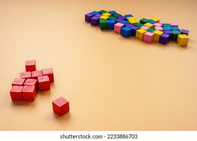 Affinity bias concept. Red cubes lie separately from other colors. - Shutterstock ID 2233886703