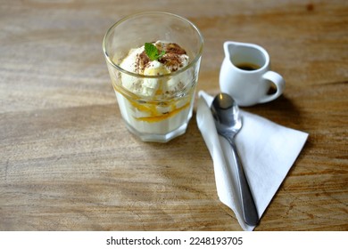 Affogato with mint leaves as a toping on wooden background - Shutterstock ID 2248193705