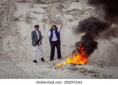 Afghan terrorists are destroying music. They burn musical supplies. They ban music in Afghanistan. The Taliban are making music fire.