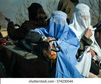 Afghan Women In Burqas Ride In The Back Of A Buggy Near To Kabul