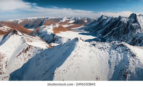 Afghanistan. Aerial view of a snowy mountainous area with a glacier, snow-covered peaks, and a cloudy sky. The landscape features a massif, ridges, and an ice cap, creating a serene winter scene - Powered by Shutterstock