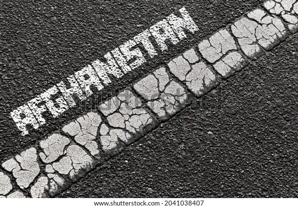 Afghanistan border,\
Border line on asphalt\
road