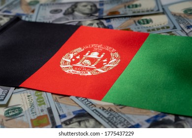 Afghanistan Flag With US Dollars As Background. Concept For Investors, Soft Focus