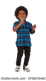 Afican-american Kid With Microphone On White Background