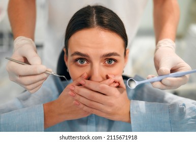 Afraid of dentist or fear of doctor. Scared and nervous patient in hospital. Upset woman with phobia having panic attack in clinic before medical operation. - Powered by Shutterstock