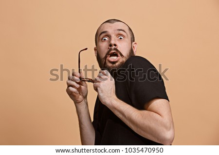 I'm afraid. Fright. Portrait of the scared man. Business man standing isolated on trendy pastel studio background. male half-length portrait. Human emotions, facial expression concept. Front view