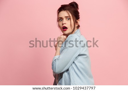 I'm afraid. Fright. Portrait of the scared woman. Business woman standing isolated on trendy pink studio background. Female half-length portrait. Human emotions, facial expression concept. Front view