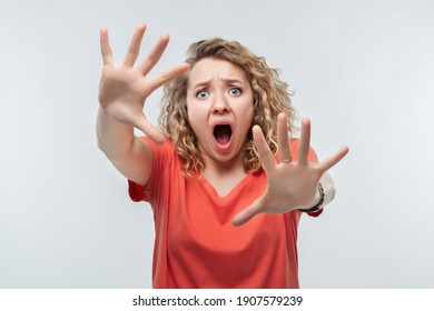 I'm Afraid. Image Of Scared Blonde Girl With Curly Hair In Casual T Shirt. Fright, Phobia, Panic Attack, Horror And Facial Expression Concept