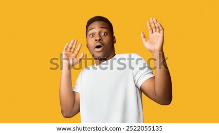 I'm Afraid. Scared black man making frightened gesture with his palms, trying to defend himself, panorama, copyspace