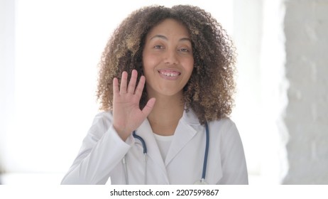 Afrcian Doctor Saying Hello By Waving Hand