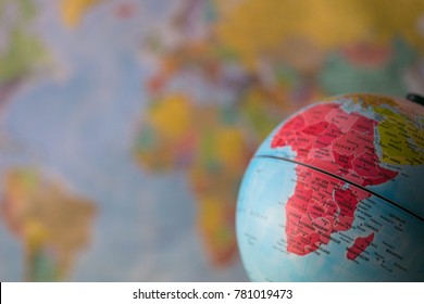 Africa Map On A Globe With Earth Map In The Background.