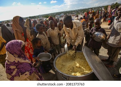 Africa, Somalia - September 28, 2011 - People Are Waiting In Line For Food Delivery. Images From The Dadaab Refugee Camp In Somalia, Where Thousands Of Somalis Are Waiting For Help From Hunger.