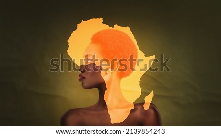 an africa symbol image on the beautiful african face of a young woman. Vogue style close-up portrait of beautiful african girl - panorama