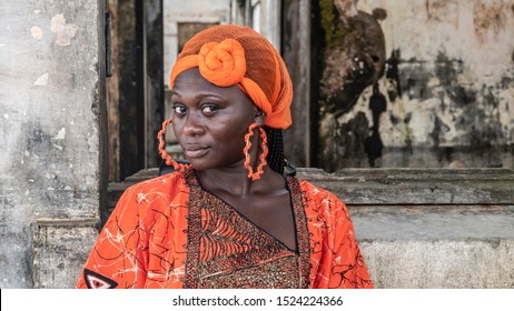 Africa Woman Stands At An Old Building From Colonization In Takoradi Ghana.