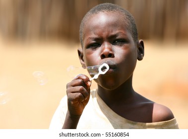 AFRICA,KENYA,SUMBURU,NOVEMBER 8: Portrait Of An African Kid Of Sumburu Tribe Village Posing To Camera, Review Of Daily Life Of Local People, Near Sumburu Park National Reserve, November 8, 2008, Kenya