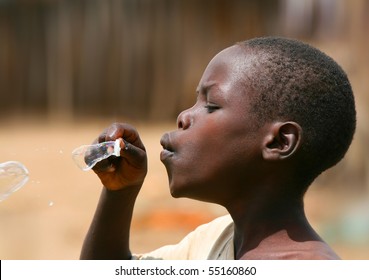 AFRICA,KENYA,SUMBURU,NOVEMBER 8: Portrait Of An African Kid Of Sumburu Tribe Village Posing To Camera, Review Of Daily Life Of Local People, Near Sumburu Park National Reserve, November 8, 2008, Kenya