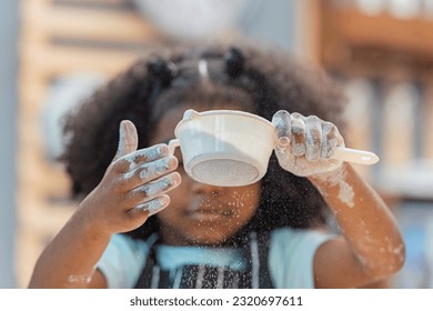 african afro black daughter kids sifting flour powder and sprinkling ingredients on massaging dough for bakery cooking. Black african daughter afro hair enjoy sifting flour wheat by sieve in kitchen - Powered by Shutterstock