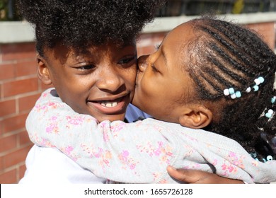 African America Sisers Hug And Show Love For Each Other Outside On A New York City Street. 