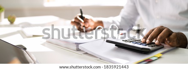 African\
American Accountant Doing Accounting And\
Tax