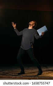 African American Actor Holding Scenario On Stage During Rehearse