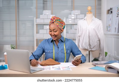 African american adult female woman fashion designer cloth tailor creative working for new collection.Happy online store owner preparing an order for shipping . - Powered by Shutterstock