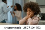 African American angry mad crazy parents mother and father quarreling shouting argue conflict quarrel mental problem at home kitchen breakup divorce sad upset girl daughter child kid suffer victim