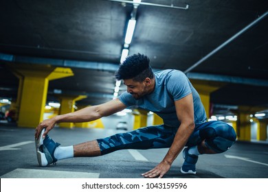 African American Athlete Man Stretching Before Workout.