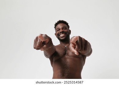 African American athletic man shirtless pointing at the camera. Mock-up. - Powered by Shutterstock