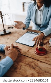 african american attorney, lawyers discussing contract or business agreement at law firm office, Business people making deal document legal, justice advice service concepts. - Shutterstock ID 2334685151