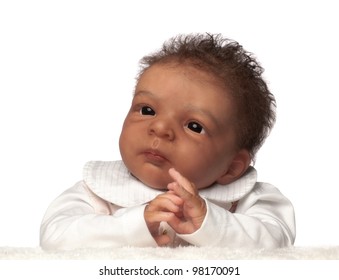 African American Baby Doll Portrait On Against White Background.