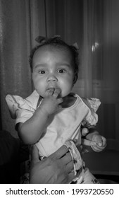 African American Baby Girl With Her Fingers In Her Mouth, Black And White