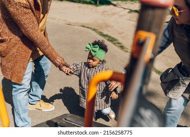 African American Baby Girl Playing On An Outdoor Playground. Kid Playing On School Or Kindergarten Yard. Activity And Play Center For Young Child.