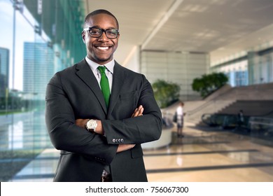 African american bank manager owner ceo business man standing confidently with pride in financial building - Powered by Shutterstock