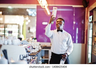 African American Bartender At Bar Flair In Action, Working Behind The Cocktail Bar. Alcoholic Beverage Preparation.
