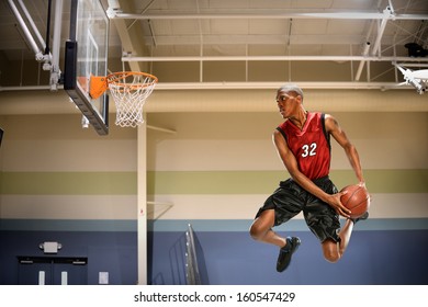 African American Basketball Player In Action In Indoor Court