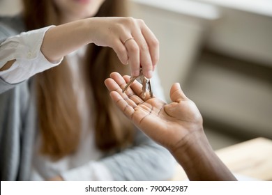 African American Black Man Buyer Getting Keys To New Home From Woman Realtor, Buying Rental Sale House And Real Estate Purchase Ownership Concept, Mortgage Loan Investment, Close Up View Of Hands