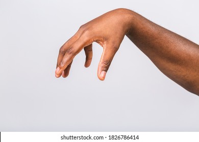 African american black man hand hanging something blank isolated on a white background. Close-up.