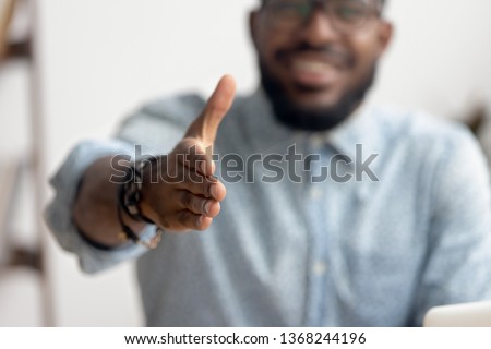 African american black professional business man hr recruiter consultant extending hand at camera for handshake concept greeting offering cooperation, welcoming at job interview, close up view