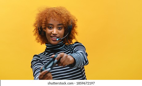 African American Black Woman With Headset Professional Gamer Playing Video Games Using Joystick . High Quality Photo