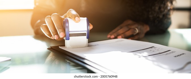 African American Black Woman Using Notary Stamp On Official Paper