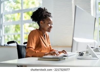 African American Black Woman Using Computer. Worker With Disability