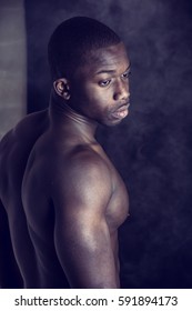 African American Bodybuilder Young Man, Naked Muscular Torso, On Dark Background