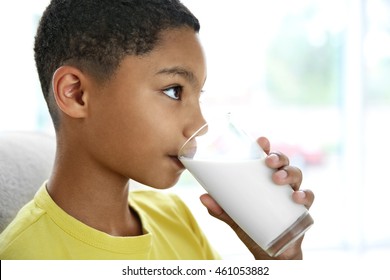 African American Boy Drinking Milk, Closeup