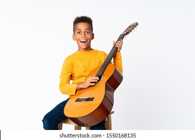 African American boy  with guitar over isolated white background