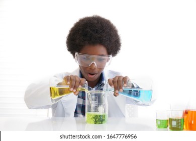 African American boy testing chemistry lab experiment